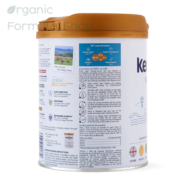 Kendamil UK Classic Cow Stage 2 European palm-oil-free whole milk follow-on formula in 800g tin, side of can, for babies 6 to 12 months. 
featuring a brown lid and a white body with detailed product information, and usage preperation instructions how to make a bottle.