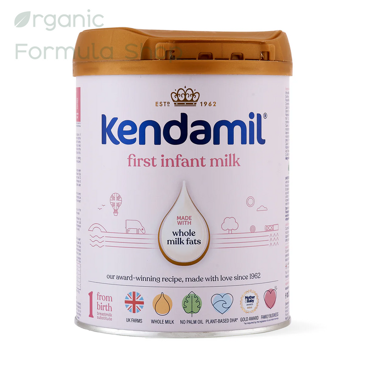 Kendamil Classic Cow Stage 1 European palm-oil-free whole milk baby formula in 800g tin, front of can, for babies 0 to 6 months. Front of canister Kendamil First Infant Milk on a plain white background. The container has a white body with blue and pink text, a beige lower section, and a brown lid.