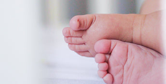 Close-up of a baby's feet with a blurred background